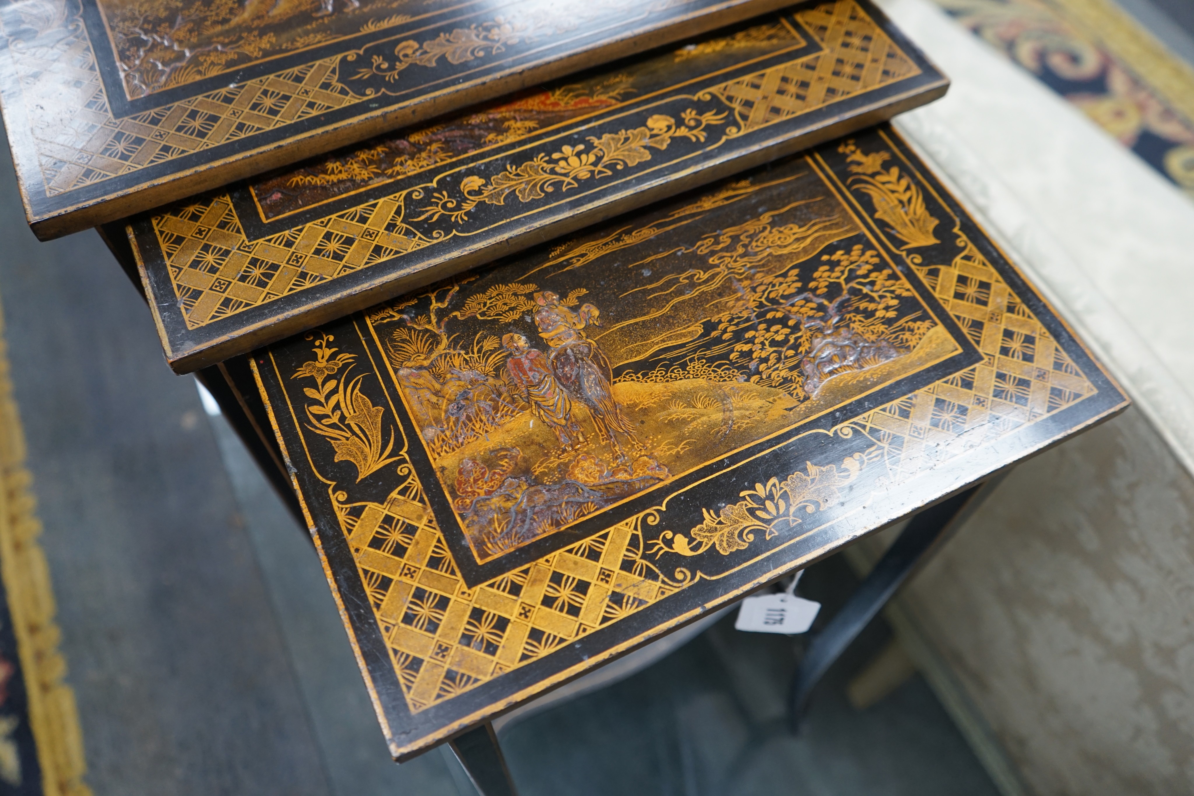 A graduating nest of three rectangular chinoiserie lacquer tea tables, width 46cm, depth 33cm, height 67cm